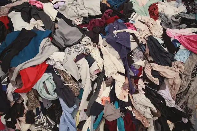 A large pile of mixed donated clothing